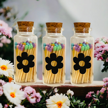 Load image into Gallery viewer, Spring Colored Tip Matches in glass jar with cork top, spring colored matches, easter decor, Flower shaped match striker on front of Vial.
